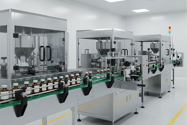 Pharmaceutical packaging machinery showing filling, capping, and labeling process